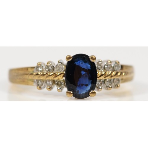 375 - A 9ct gold sapphire ring with diamond set shoulders, L 1/2, 2.7g