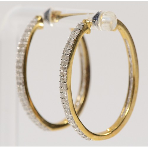 377 - A pair of 9ct gold diamond oval hoop earrings, 30mm, 5.3g