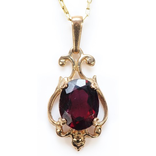 381 - A 9ct gold garnet pendant with a chain, 18mm, 2.2g