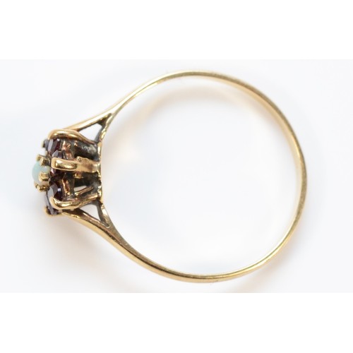 390 - A 9ct gold garnet and opal floral cluster ring, O, 1.6g