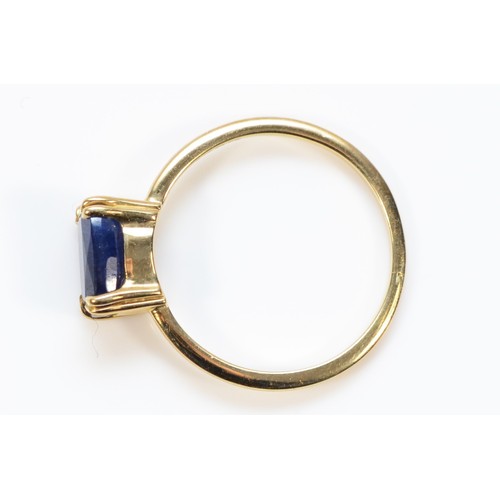 406 - A 9ct gold blue gemstone solitaire ring, 7mm x 5mm, K, 1.4g