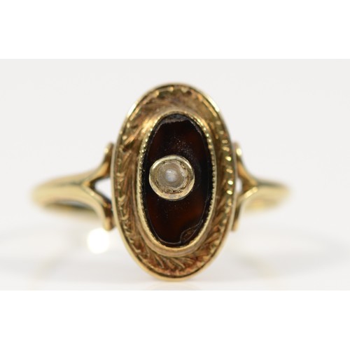 410 - A 14k gold black onyx and seed pearl dress ring, N, chip to the edge of the onyx, 2.3g