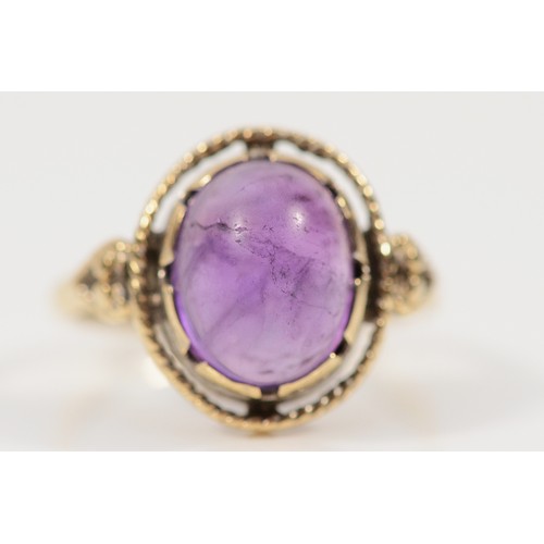 411 - A 9ct gold cabochon cut amethyst dress ring, H, 2.6g