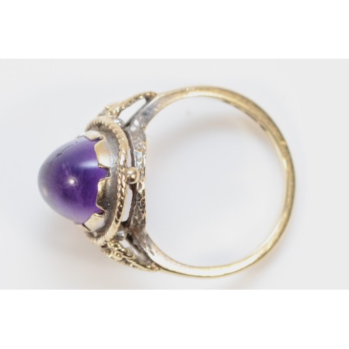 411 - A 9ct gold cabochon cut amethyst dress ring, H, 2.6g