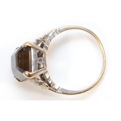 412 - A 9ct white gold smokey quartz cocktail ring, with floral design to the shoulders, 12mm x 10mm quart... 