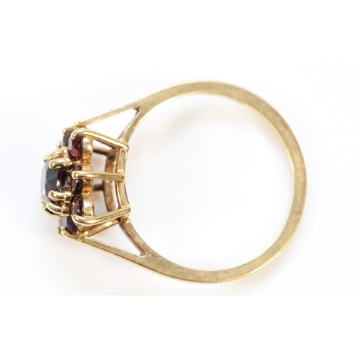 420 - A 9ct gold garnet cluster ring, London 1979, O, 2.8g