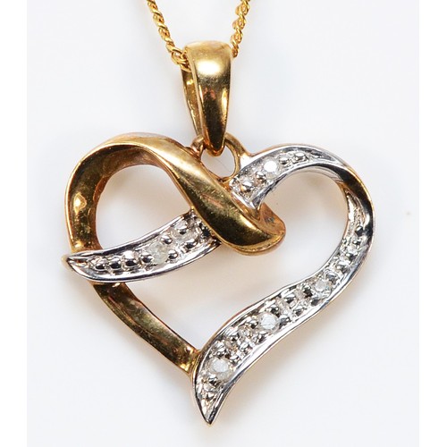 428 - A 9ct gold diamond heart pendant with a chain, 15mm, 1.5g