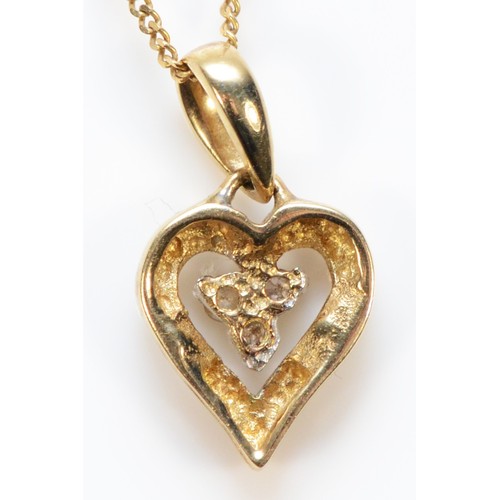 431 - A 9ct gold diamond heart pendant with chain, 7mm, 1.4g