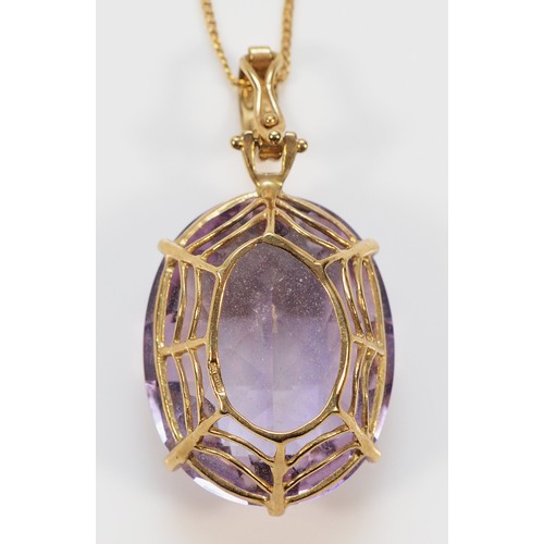 433 - A 9ct gold amethyst pendant with a chain, 25mm x 20mm, 9.6g