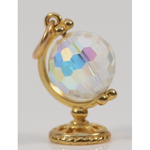 445 - A 9ct gold glass spinning globe charm, 15mm, 1.3g