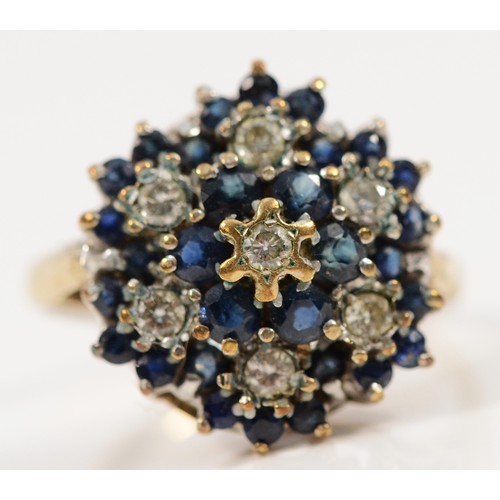 447 - A 9ct gold sapphire and diamond cluster ring, P, 3.8g