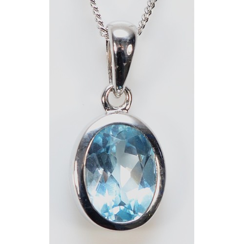 453 - A 9ct white gold blue gemstone pendant with a chain, 17mm, 2.6g