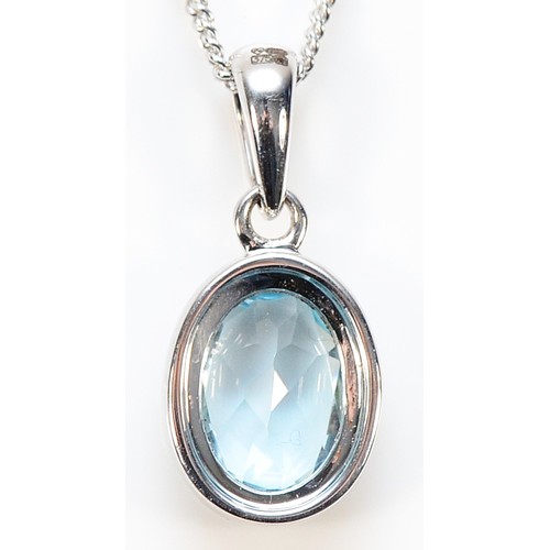 453 - A 9ct white gold blue gemstone pendant with a chain, 17mm, 2.6g