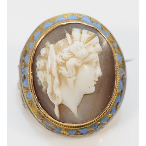 456 - An unmarked 15ct gold shell cameo brooch depicting a classical lady, base metal back added at a late... 