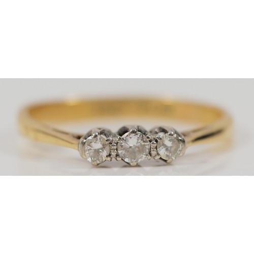 459 - An 18ct gold and platinum brilliant cut diamond three stone ring, P, 2g