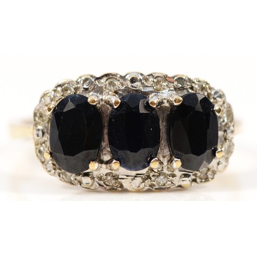 463 - A 9ct gold sapphire and diamond cluster ring, M 1/2, 2.7g