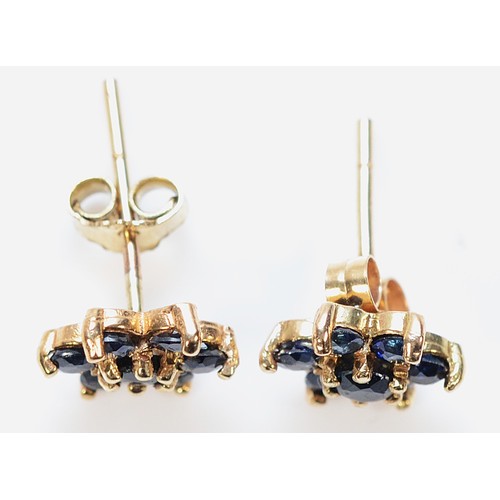 467 - A pair of 9ct gold sapphire floral cluster earrings with scroll backs, 1.3g