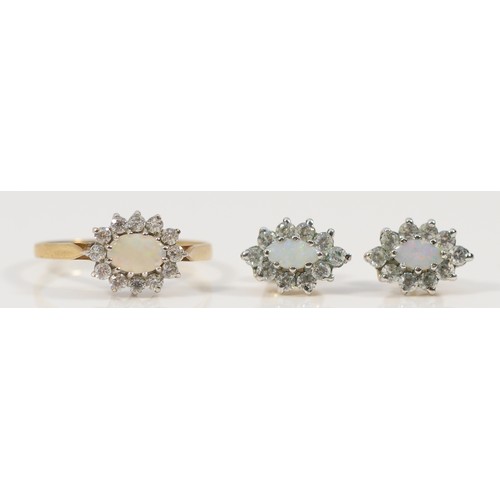 472 - A 9ct gold opal and white gemstone cluster ring, N, with a pair of 9ct gold matching earrings, 2.8g