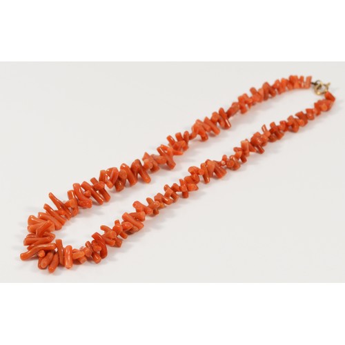 473 - A 9ct gold clasped coral necklace, 24g