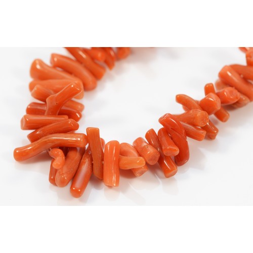 473 - A 9ct gold clasped coral necklace, 24g