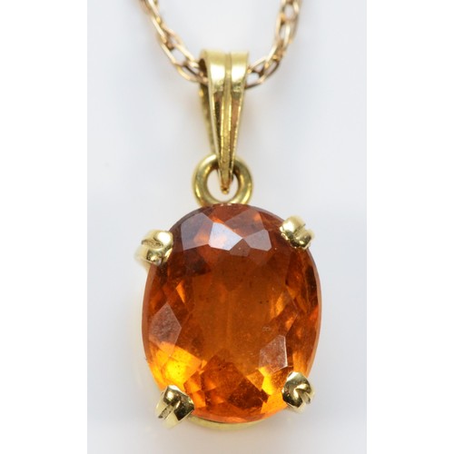 477 - An 18ct gold citrine pendant, on a 9ct gold chain, 2.8g