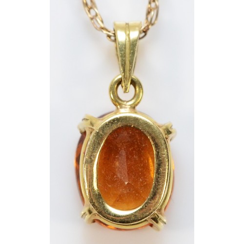 477 - An 18ct gold citrine pendant, on a 9ct gold chain, 2.8g