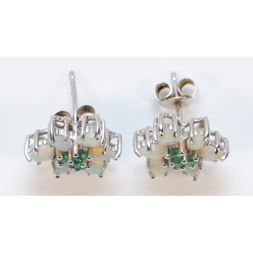 488 - A pair of 9ct white gold opal and emerald floral cluster earrings with scroll backs, 2.5g