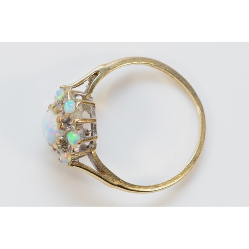 502 - A 9ct gold opal and diamond cluster ring, J, 1.7g