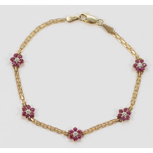 511 - A 9ct gold ruby and diamond floral bracelet, 18cm, 2.9g