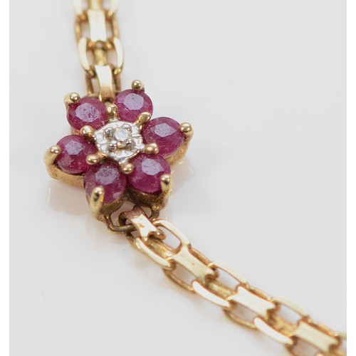 511 - A 9ct gold ruby and diamond floral bracelet, 18cm, 2.9g