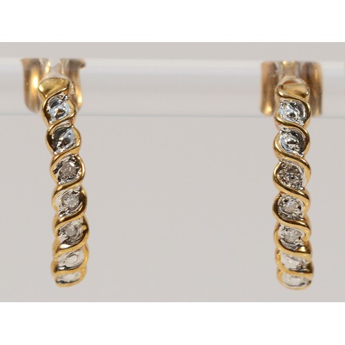 512 - A pair of 9ct gold diamond half hoop earrings with scroll backs, 15mm, 1.8g