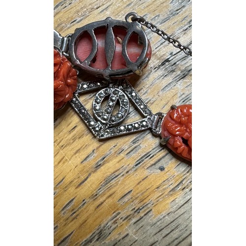 158 - A sterling silver, coral and marcasite bracelet, with a sterling silver and coral brooch, 55mm, 20g