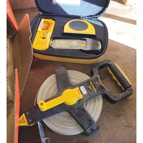 A boxed Strait-Line stud finder, a 50m hand held tape measure, a Wagner ...