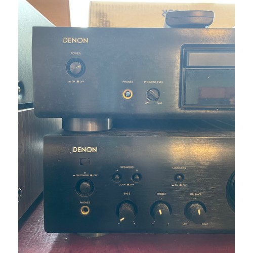 A Denon Hi-FI amplifier PMA-510AE, together with a Denon compact disc ...