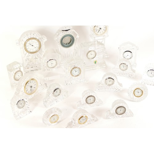 A selection of crystal glass mantel clocks, bedside clocks and ...