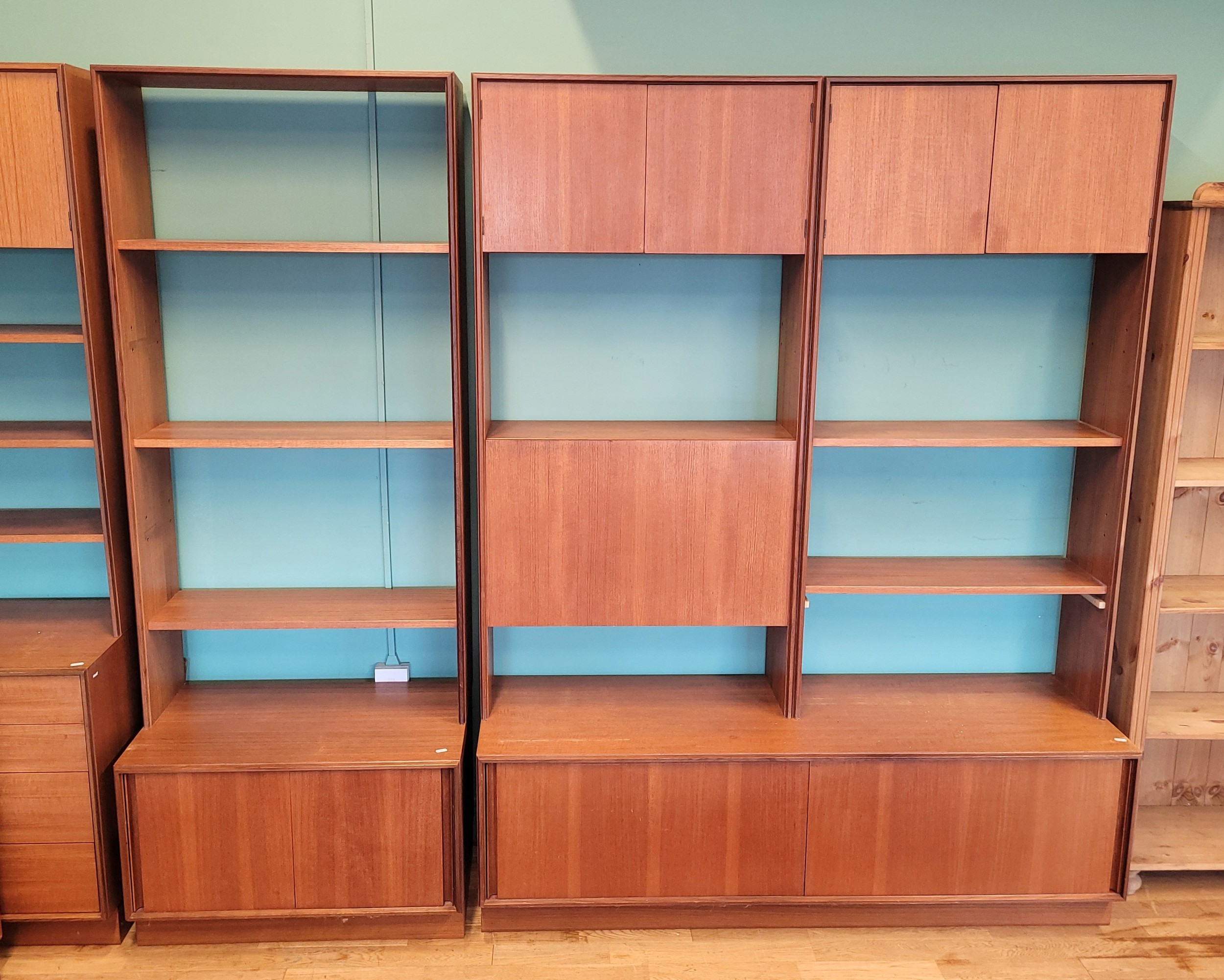 G-Plan; A mid 20th century teak three-section modular wall unit, top ...