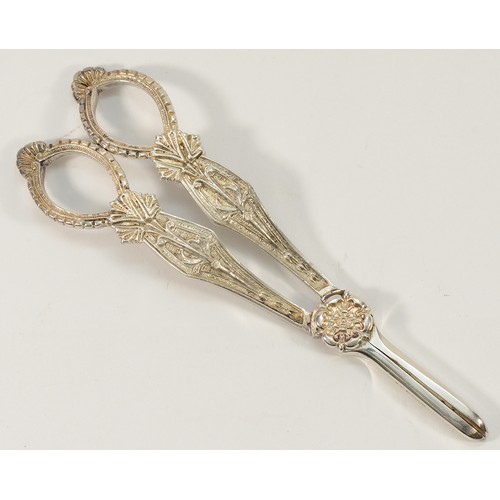 9 - A silver pair of grape scissors, Sheffield 1991, decorated with the Yorkshire rose, 17cm, 101gm.