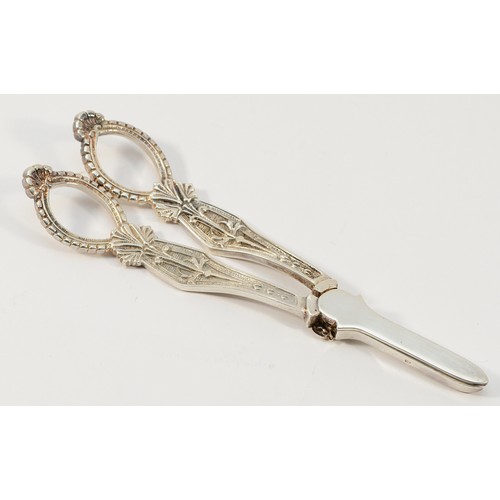 9 - A silver pair of grape scissors, Sheffield 1991, decorated with the Yorkshire rose, 17cm, 101gm.