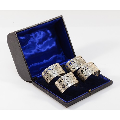 24 - Four Edwardian silver napkin rings, Birmingham 1903, two by S Blanckensee & Son Ltd, two by Reynolds... 