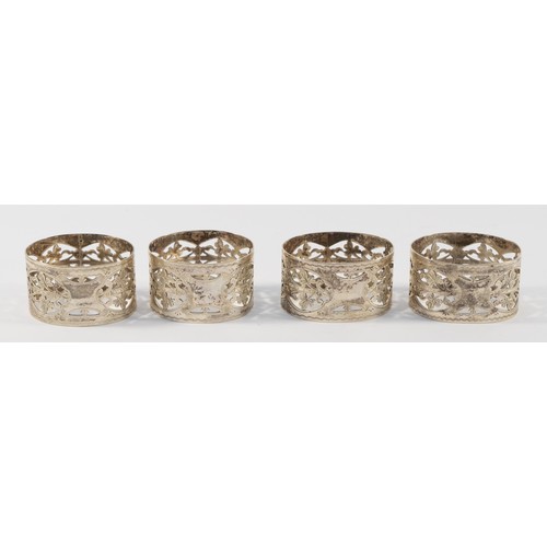 24 - Four Edwardian silver napkin rings, Birmingham 1903, two by S Blanckensee & Son Ltd, two by Reynolds... 