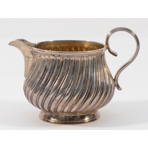 34 - A Victorian silver ribbed cream jug, by Charles Stuart Harris, London 1882, 6cm tall, 55gm, cased.