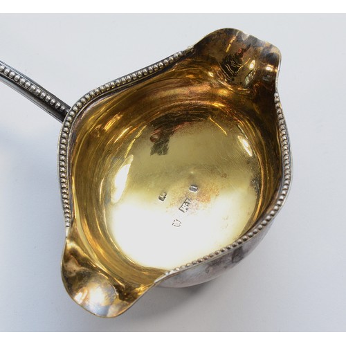 28 - Of Masonic interest, a George III silver and whalebone double lip ladle, by Thomas Morley, London 17... 