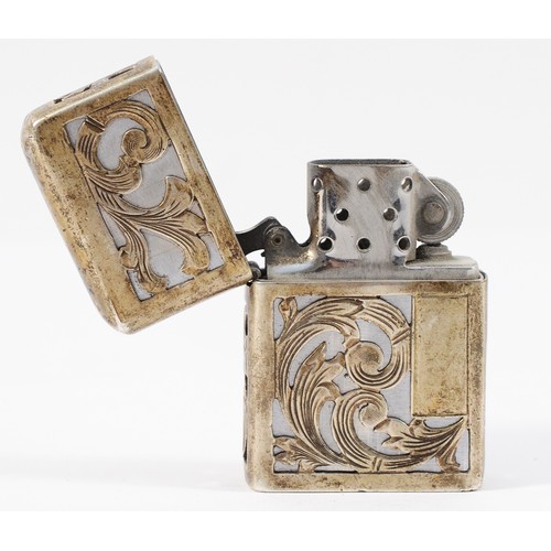 52 - A Mexican sterling silver Zippo style petrol lighter with Aztec motif to the front.