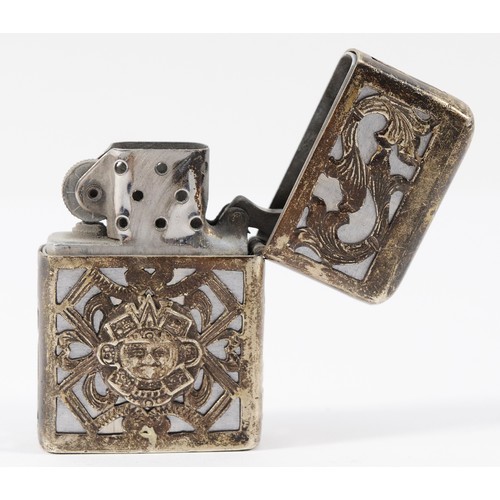 52 - A Mexican sterling silver Zippo style petrol lighter with Aztec motif to the front.