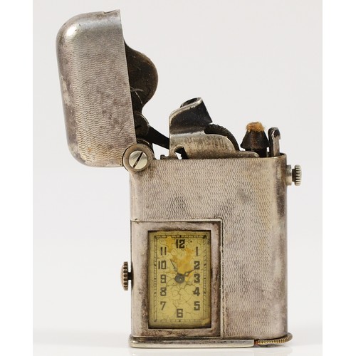 54 - A Thorens Art Deco electroplated combination watch/lighter, with engine turned decoration, USA and B... 