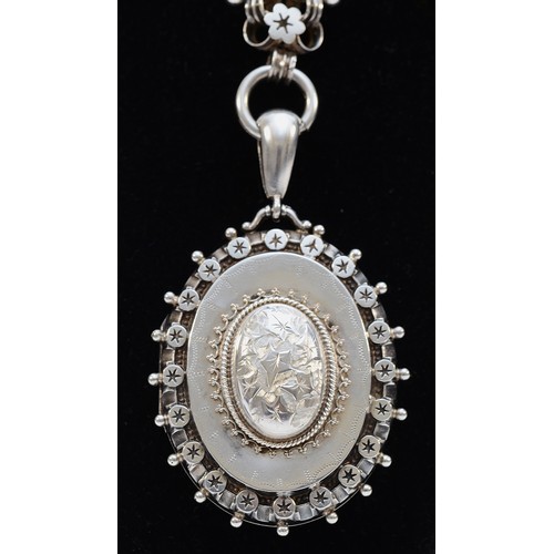 66 - A Victorian silver locket and collar necklace, Birmingham 1884, makers R.J.D, double sided locket, 5... 