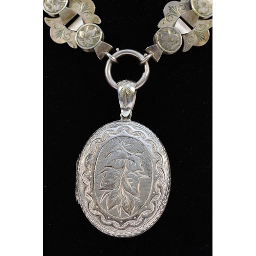 67 - A Victorian silver locket and collar, unmarked, c.1880/1890, the locket with all over engraved decor... 