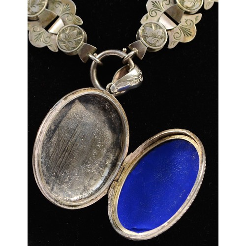 67 - A Victorian silver locket and collar, unmarked, c.1880/1890, the locket with all over engraved decor... 