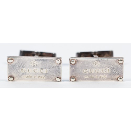 75 - Gucci, a silver pair of rectangular panel cufflinks, Italy control marks, signed, 22 x 10mm, 14gm po... 