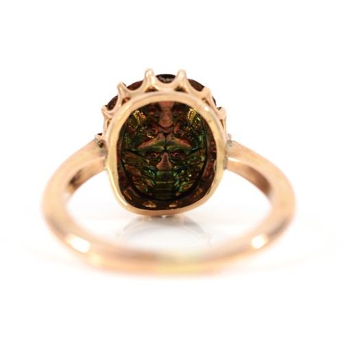 111 - An unmarked 9ct gold scarab beetle ring, possible resizing marks, O, 3.1g